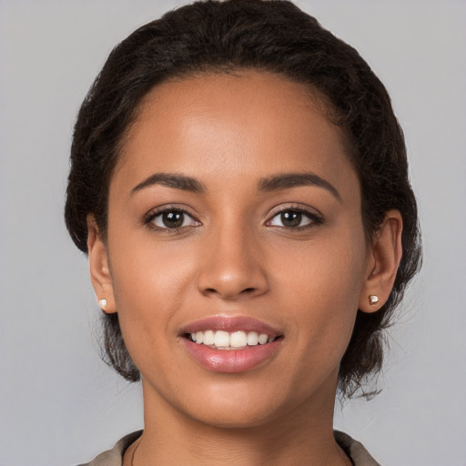 Joyful white young-adult female with long  brown hair and brown eyes