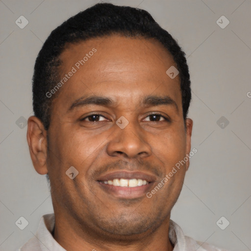 Joyful latino young-adult male with short  brown hair and brown eyes