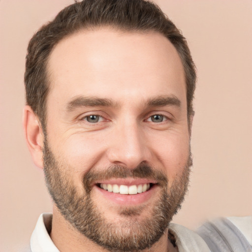 Joyful white young-adult male with short  brown hair and brown eyes