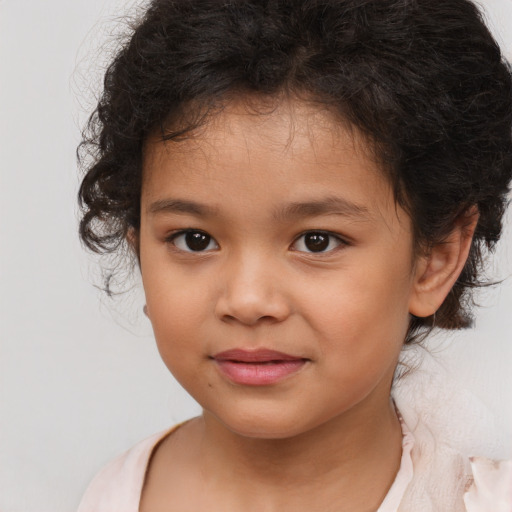 Joyful white child female with medium  brown hair and brown eyes