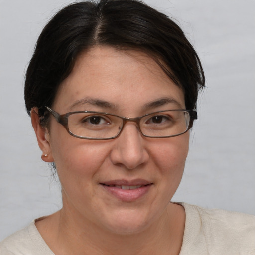 Joyful white adult female with short  brown hair and brown eyes