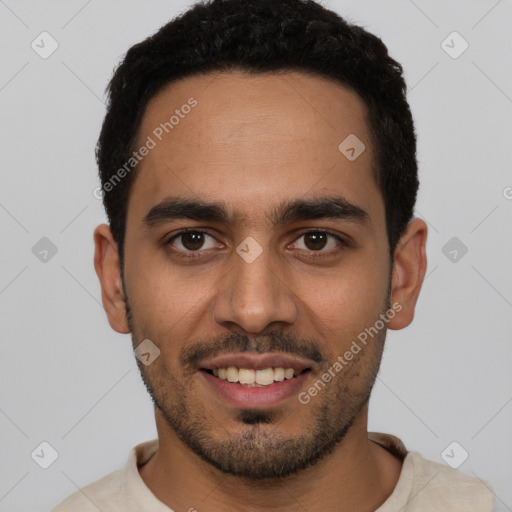Joyful white young-adult male with short  black hair and brown eyes