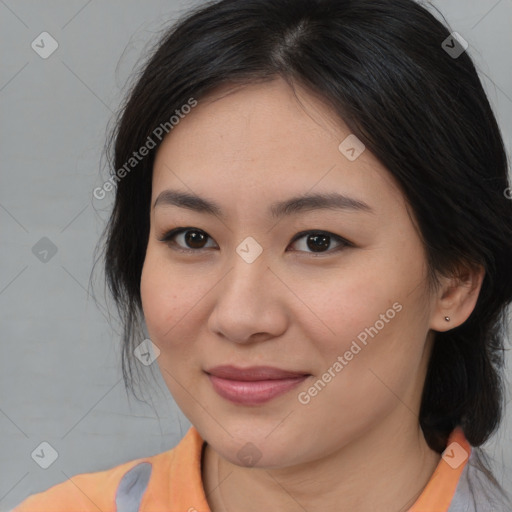 Joyful asian young-adult female with medium  brown hair and brown eyes