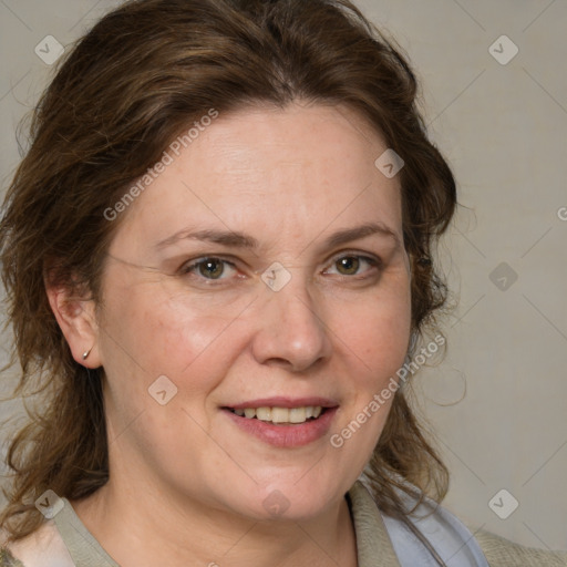 Joyful white adult female with medium  brown hair and blue eyes