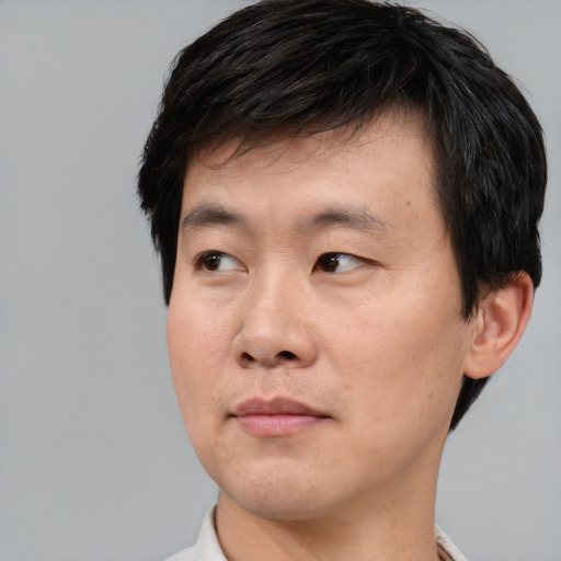 Neutral asian young-adult male with short  black hair and brown eyes
