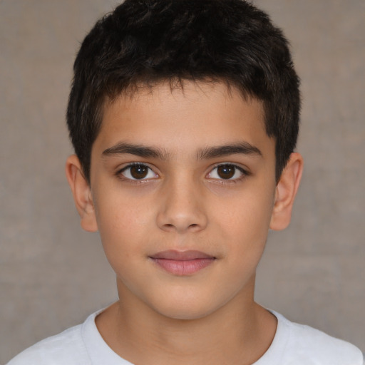 Joyful white child male with short  brown hair and brown eyes