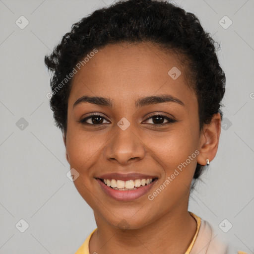 Joyful latino young-adult female with short  brown hair and brown eyes