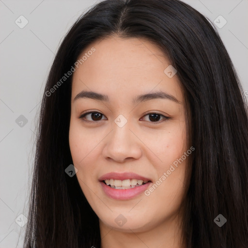 Joyful asian young-adult female with long  brown hair and brown eyes