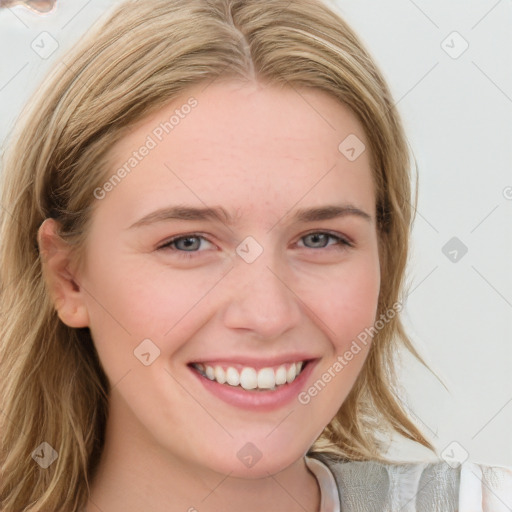 Joyful white young-adult female with medium  brown hair and blue eyes