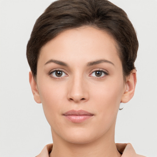 Neutral white young-adult female with short  brown hair and brown eyes