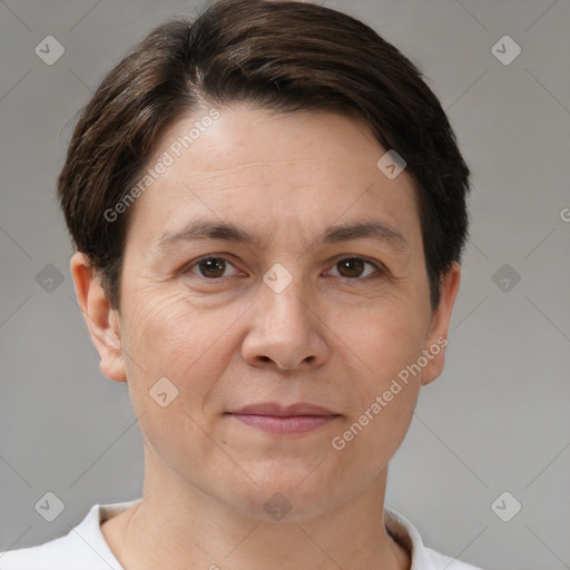 Joyful white adult female with short  brown hair and brown eyes