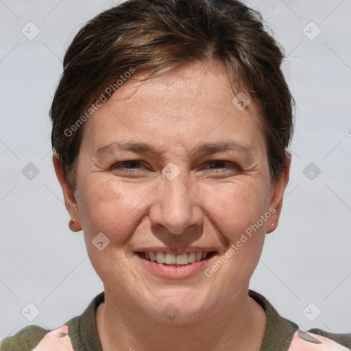 Joyful white adult female with short  brown hair and brown eyes