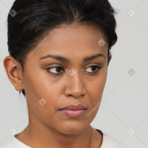 Joyful latino young-adult female with short  brown hair and brown eyes