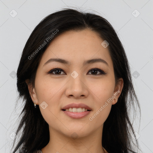 Joyful latino young-adult female with long  brown hair and brown eyes