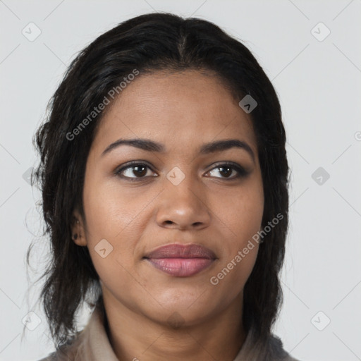 Joyful black young-adult female with medium  brown hair and brown eyes