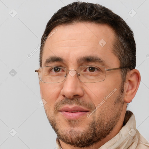 Joyful white adult male with short  brown hair and brown eyes