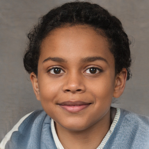 Joyful black child female with short  brown hair and brown eyes