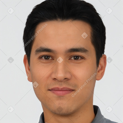 Joyful asian young-adult male with short  black hair and brown eyes