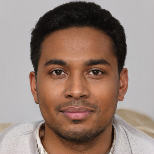Neutral black young-adult male with short  black hair and brown eyes