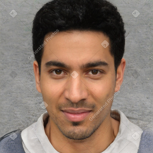 Joyful white young-adult male with short  black hair and brown eyes