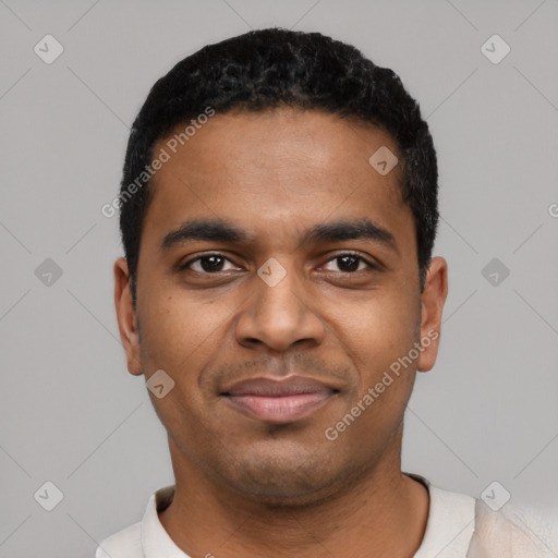 Joyful black young-adult male with short  black hair and brown eyes