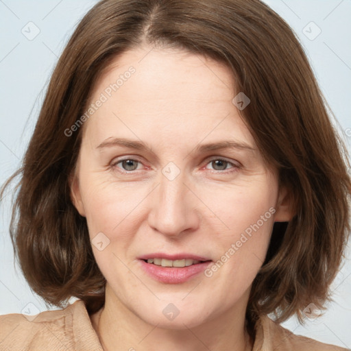 Joyful white adult female with medium  brown hair and grey eyes