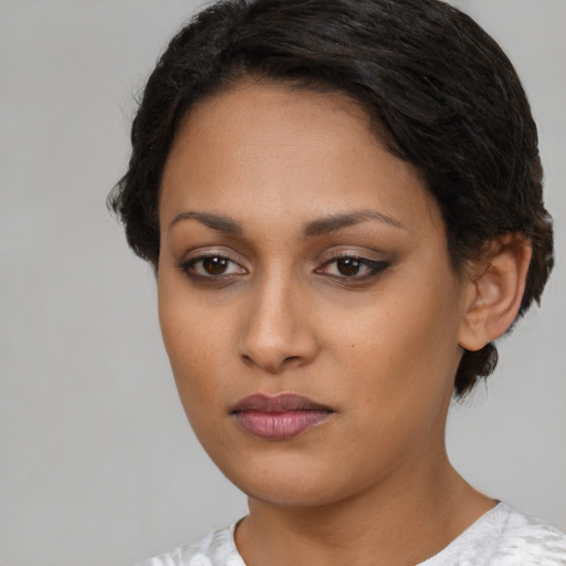 Neutral latino young-adult female with short  black hair and brown eyes