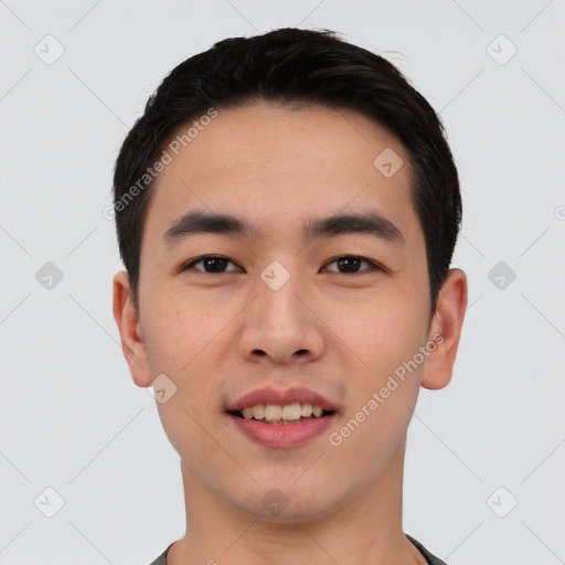 Joyful asian young-adult male with short  black hair and brown eyes