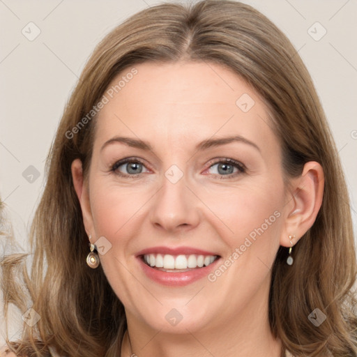 Joyful white adult female with long  brown hair and brown eyes