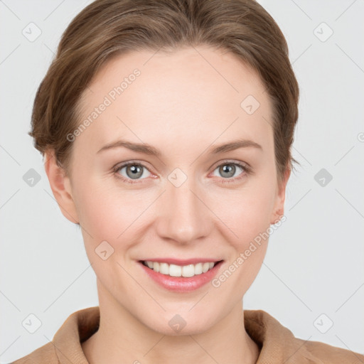 Joyful white young-adult female with short  brown hair and grey eyes