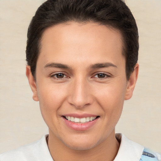 Joyful white young-adult female with short  brown hair and brown eyes