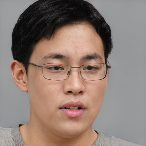 Neutral asian young-adult male with short  brown hair and brown eyes