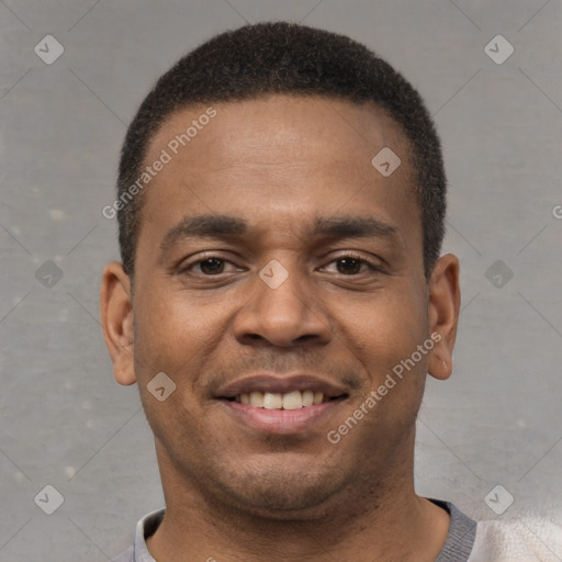 Joyful latino young-adult male with short  brown hair and brown eyes