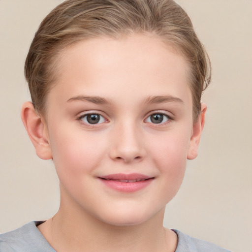 Joyful white child female with short  brown hair and grey eyes