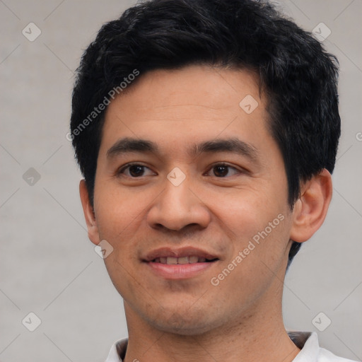 Joyful asian young-adult male with short  black hair and brown eyes