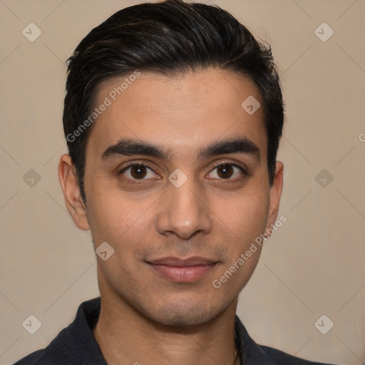 Joyful white young-adult male with short  black hair and brown eyes