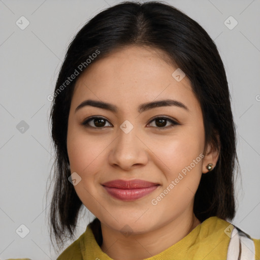 Joyful latino young-adult female with medium  brown hair and brown eyes