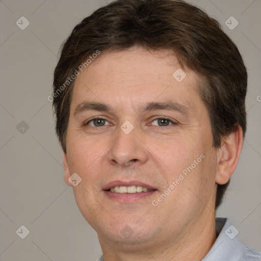 Joyful white adult male with short  brown hair and brown eyes