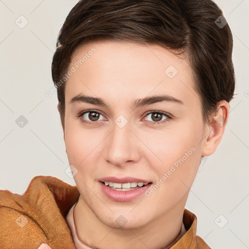 Joyful white young-adult female with short  brown hair and brown eyes