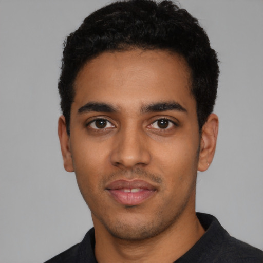 Neutral latino young-adult male with short  black hair and brown eyes