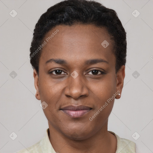 Joyful black young-adult female with short  black hair and brown eyes