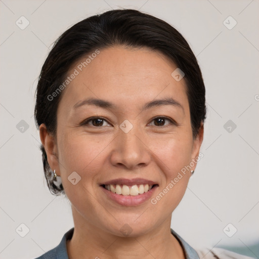 Joyful white adult female with medium  brown hair and brown eyes