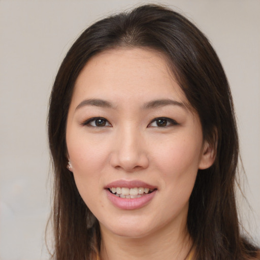 Joyful white young-adult female with medium  brown hair and brown eyes