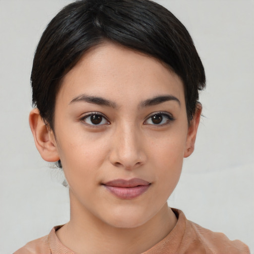 Joyful asian young-adult female with short  brown hair and brown eyes