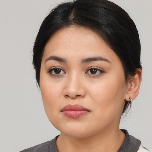 Neutral latino young-adult female with medium  black hair and brown eyes