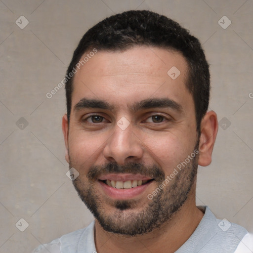 Joyful white young-adult male with short  black hair and brown eyes