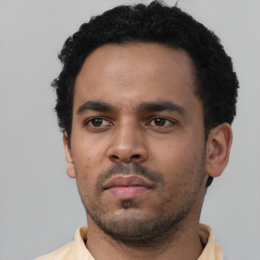 Neutral black young-adult male with short  black hair and brown eyes