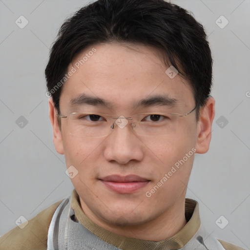 Joyful asian young-adult male with short  brown hair and brown eyes