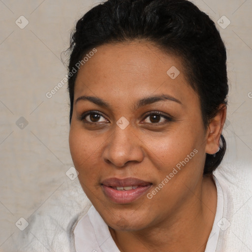 Joyful black young-adult female with short  brown hair and brown eyes