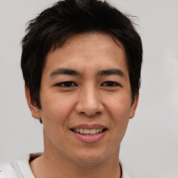 Joyful asian young-adult male with short  brown hair and brown eyes